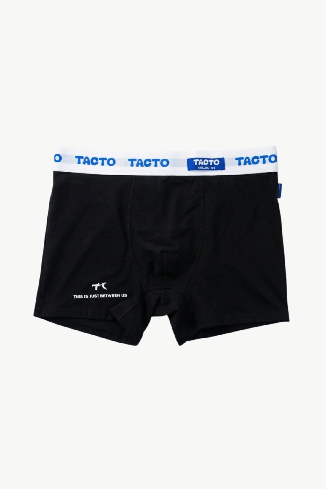 Person wearing black boxer briefs with a visible brand logo on a plain background