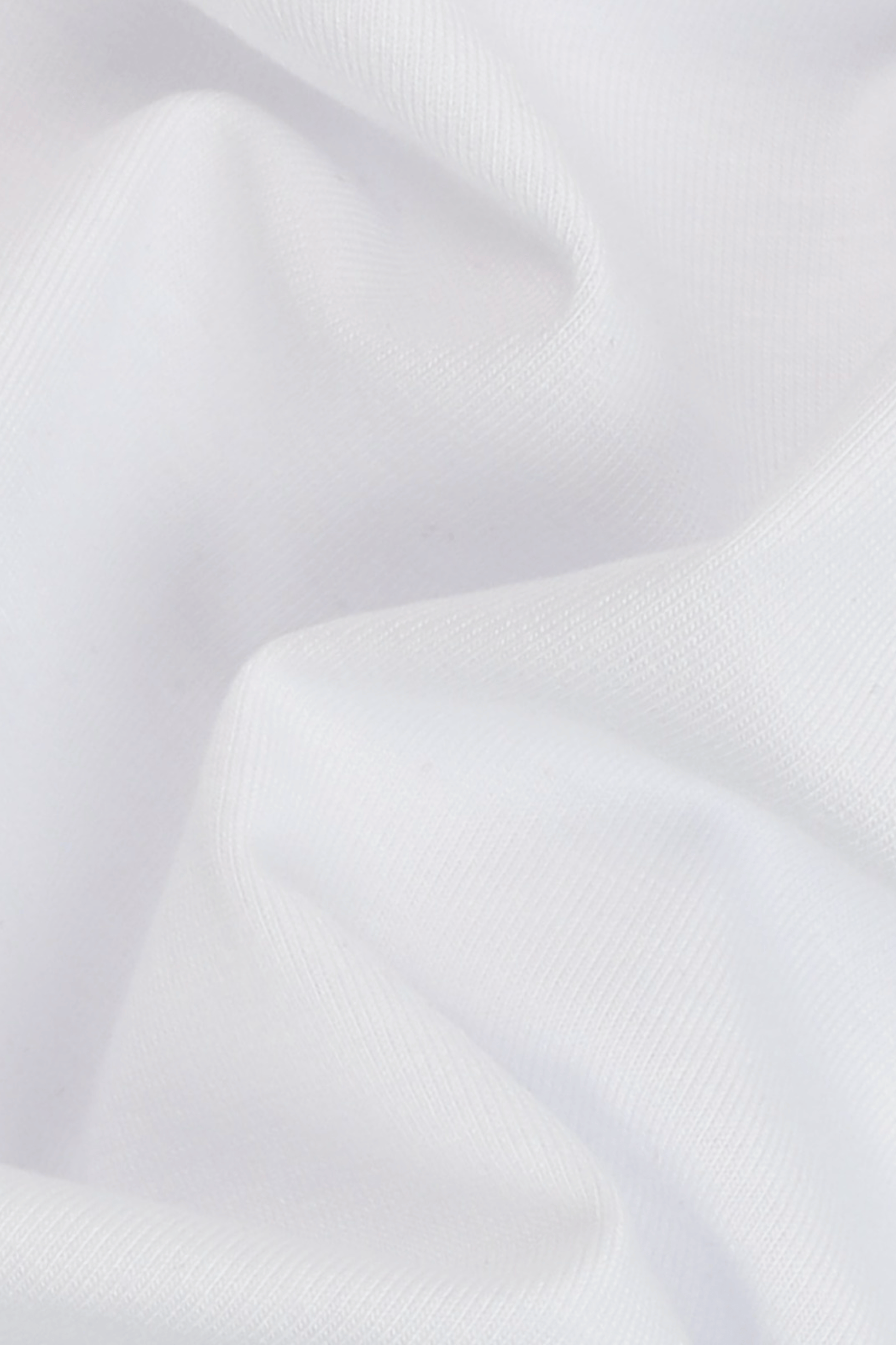 Close-up of white fabric with folds. The Pressing Men's Underwear Boxer Brief White Fabric Detail Organic Cotton-Modal, No Polyester — TACTO Collective