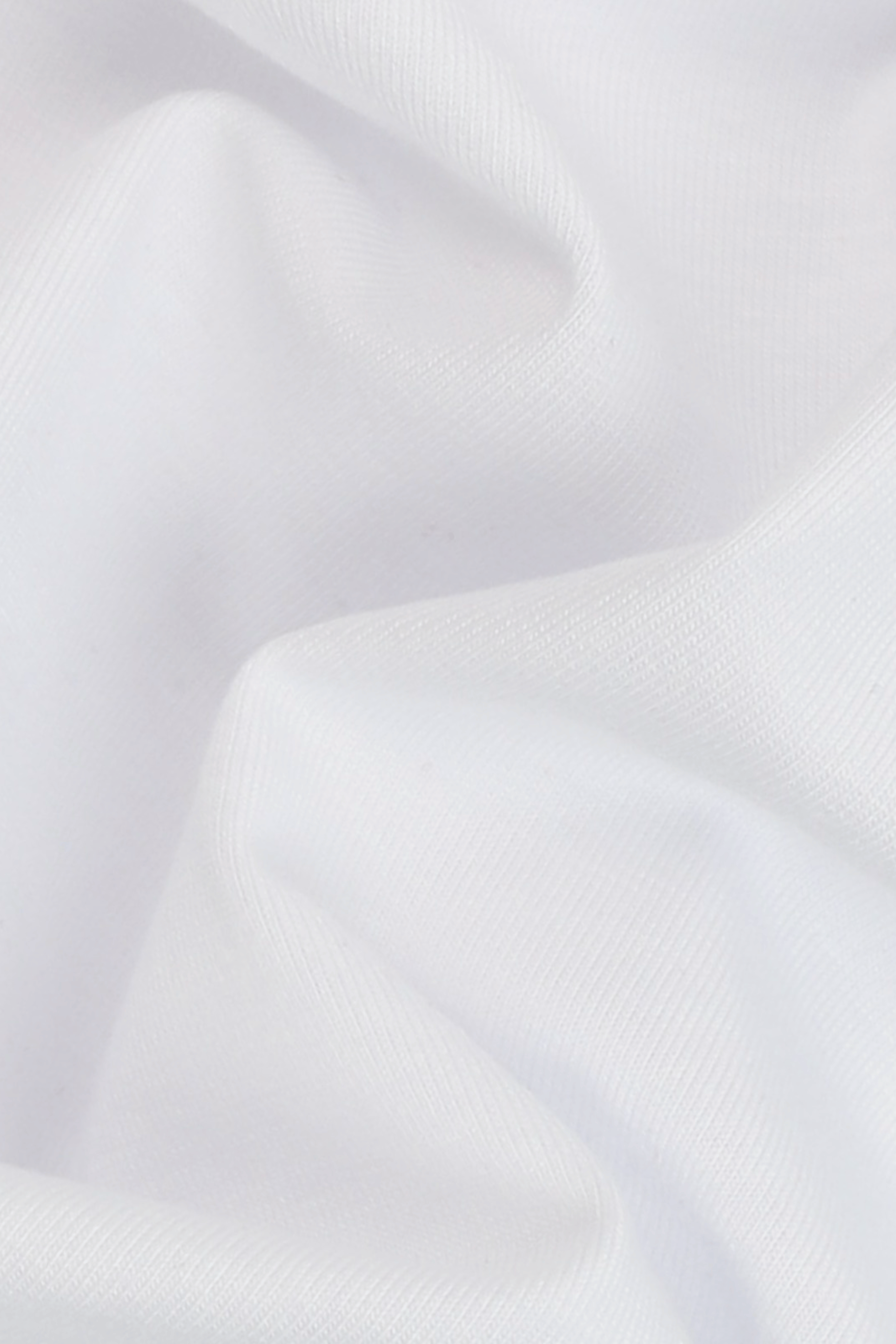 Close-up of white fabric with folds. The Pressing Men's Underwear Boxer Brief White Fabric Detail Organic Cotton-Modal, No Polyester — TACTO Collective