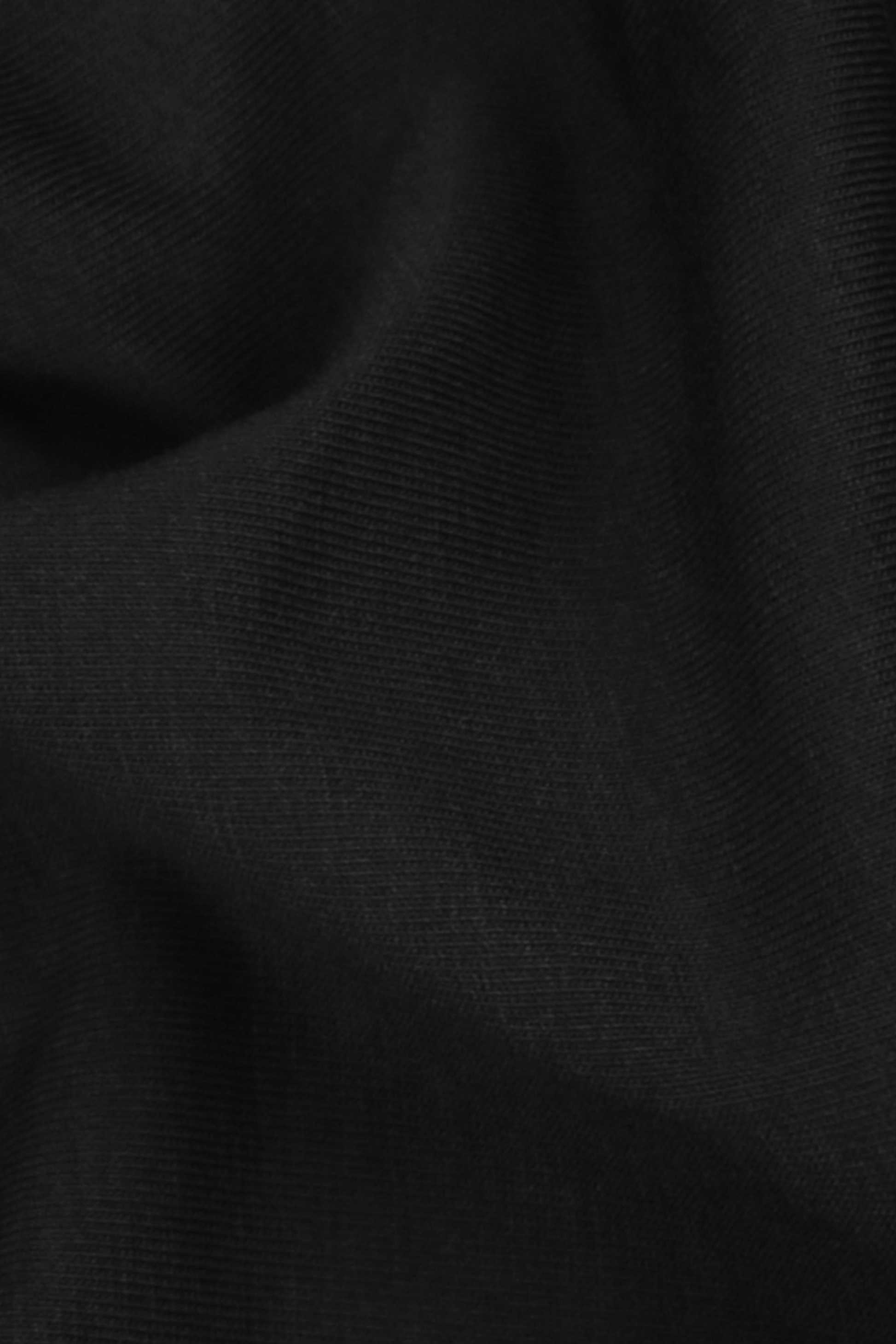 Close-up of black fabric texture. Organic cotton and modal fabric